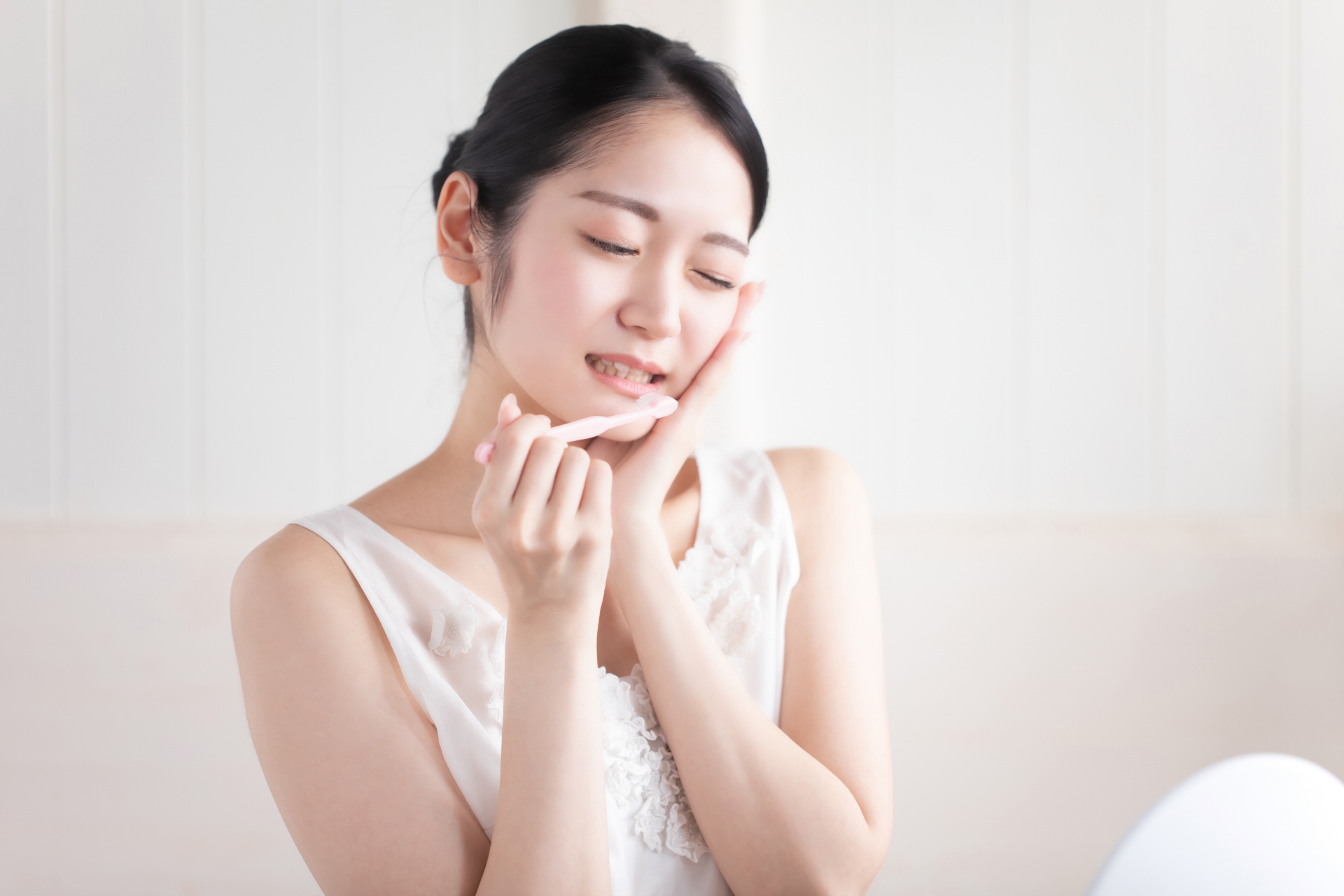 虫歯・知覚過敏・歯周病の女性